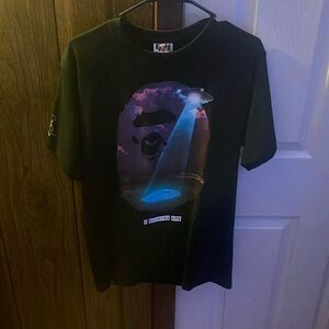 A black bathing ape tee with symbol in white, black, purple, and blue